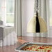 A Hanson Heat Lamp with a brass finish retracted over a table of food in a hotel buffet.
