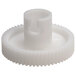 A close-up of a white plastic Bar Maid gear with a hole.