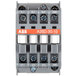 An Avantco Replacement Contactor with a rectangular grey body and white and black buttons.
