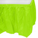 A Fresh Lime Green plastic table skirt on a table.