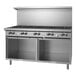 A large stainless steel Garland natural gas range with 10 burners and 2 storage bases.