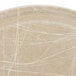 A close up of a beige Cambro round tray with white abstract lines.