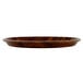 A Cambro round fiberglass tray with a Burma Teak wooden surface.