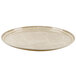 A tan Cambro oval fiberglass tray with an abstract design.