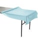 A table with a blue tablecloth on it.