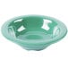 A rainforest green melamine bowl with a white rim.