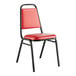 A red Lancaster Table & Seating banquet chair with black frame and 1" padded seat.