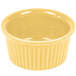 A yellow CAC China fluted ramekin.