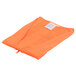 A Cordova orange high visibility safety vest in a plastic bag with a zipper.
