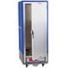 A blue and silver metal Metro C5 heated holding cabinet with a solid door open.