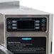 A TurboChef electric countertop conveyor oven on a counter in a professional kitchen.