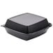 A black Dart foam square container with a perforated hinged lid.