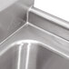 A close-up of a stainless steel Advance Tabco two compartment sink.