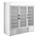 A large white refrigerated glass door merchandiser with three doors and interior shelving.