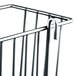A chrome Metro storage basket with a handle.