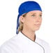 A woman wearing a blue Headsweats chef bandana.