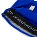 A royal blue Headsweats chef bandana with a logo on it.