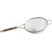 A Tablecraft medium double mesh strainer with a wooden handle.