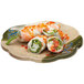 A GET Japanese Traditional scallop plate with food on it.