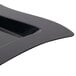 A black plastic square plate with a wavy edge.