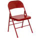 A red Flash Furniture metal folding chair.