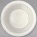 A Carlisle white melamine ramekin on a gray surface.