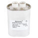 A white capacitor with metal ends.