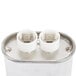 A white metal box with two white round Capacitor Service Kit caps.