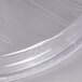 A clear plastic bowl cover with a logo on it.