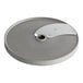 A silver circular metal Robot Coupe slicing disc with a hole in the center.