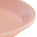 A dark peach Cambro fiberglass fast food tray with a rim.