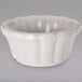 a white bowl with wavy edge