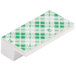 A white and green rectangular object with a green and white plaid pattern.