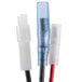 A close up of three wires with red and blue plastic connectors.