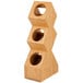 A wooden Cal-Mil vertical stand with three holes.