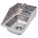 A stainless steel Advance Tabco drop-in sink with a faucet.