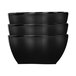 A stack of three black Elite Global Solutions square melamine bowls.