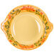 A yellow and orange bowl with a floral design.