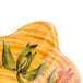 A yellow and orange GET Venetian bowl with a tropical design.