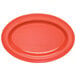 A red oval melamine platter with a coral rim.