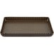 A brown rectangular fluted tart/quiche pan with a scalloped edge and removable bottom.