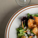 A Tuxton brown speckle narrow rim china bowl filled with shrimp salad on a table.