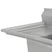 A stainless steel Advance Tabco commercial sink with left drainboard on a counter.