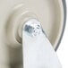A white wheel with a metal plate on it.