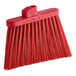 A Carlisle heavy duty angled broom head with red unflagged bristles.