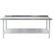 A stainless steel Advance Tabco work table with a galvanized undershelf.