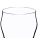 A close up of a Libbey bell soda glass with a black rim.