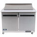 An Arctic Air stainless steel 2 door mega top refrigerator on a counter.