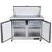 An Arctic Air stainless steel refrigerator with two open doors.