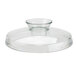 A clear glass lid with a small circular base on a white surface.